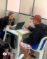 Imagem da equipe da defensoria prestando atendimento no mutirão