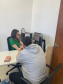 Imagem contendo assessor(a) atendendo usuário(a) no mutirão Defensoria com Elas.