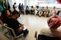 imagem com diversas pessoas representantes de coletivos negros sentados durante a roda de conversa com o NUPIER