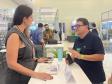 Imagem horizontal colorida em que se vê o estande da DPE-PR no evento Paraná Mais Cidades.