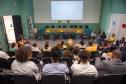Auditório lotado com muitas pessoas observam o evento de celebração de um ano do Observatório de Violência contra a Mulher Indígena.  