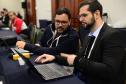 Imagem com foto de cobertura do primeiro dia de atividades do Congresso Nacional de Tecnologia das Defensorias