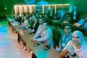 Equipe da DPE-PR assiste palestra durante o EXPOJUD 2025. 