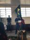 Formanda da 1ª turma de Operadores Em Direitos Étnicos E Coletivos Faxinalenses recebendo o diploma.
