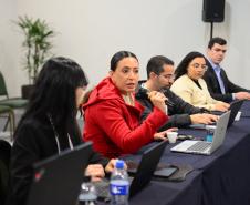 Imagem com foto de cobertura do primeiro dia de atividades do Congresso Nacional de Tecnologia das Defensorias