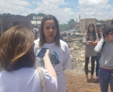 Na imagem vemos a Dra. Olenka Lins no local do incidente dando uma entrevista e vestindo uma camiseta da DPPR. 