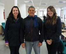 A assistente social do CAM Tânia Moreira, o assistido da DPPR e militante do Movimento Nacional da População em Situação de Rua Vilmar Rodrigues, e a estagiária Camila Suian de Freitas.